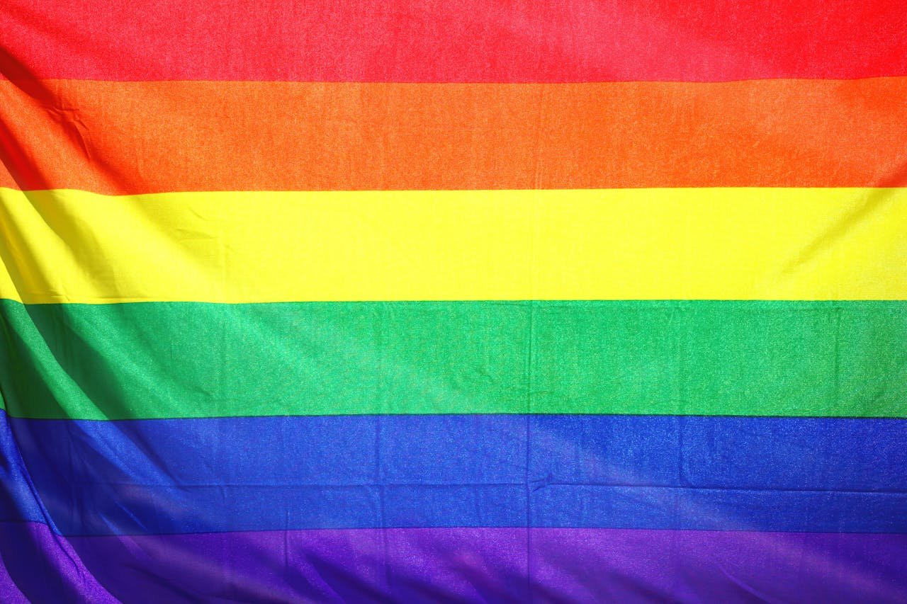 About Close-up of a colorful rainbow flag symbolizing LGBT pride and diversity.